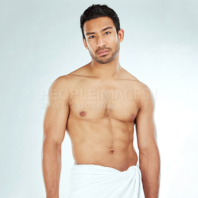 Buy stock photo Chest, body and portrait of asian man in a towel in studio for cleaning, hygiene and care on grey background. Face, confidence muscular Japanese model with glowing skin grooming results after shower