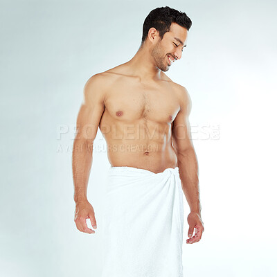 Buy stock photo Shower, towel and happy fitness man in studio for wellness, hygiene or body care routine on white background. Cleaning, grooming or muscular Japanese male model with pamper, cosmetics or treatment