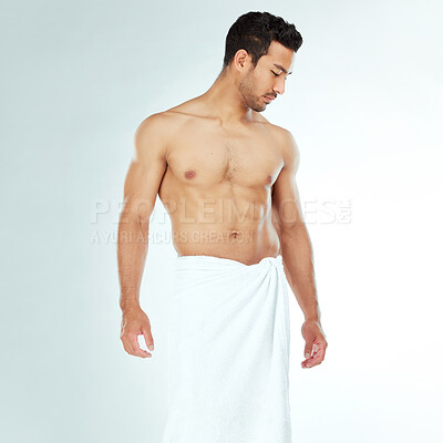 Buy stock photo Body, cleaning and thinking asian man in a towel in studio for beauty, hygiene and care on grey background. Chest, relax and muscular Japanese model with glowing skin grooming results after shower