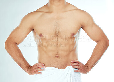Buy stock photo Body, closeup and fitness man in a towel in studio for shower, wellness or grooming on white background. Chest, stomach and male model relax in a bathroom for cosmetic, care or cleaning with sixpack