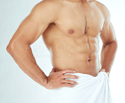Buy stock photo Fitness, body and closeup of man in a towel in studio for shower, wellness or grooming on white background. Chest, stomach and male model in a bathroom for cosmetic, care or cleaning with a sixpack