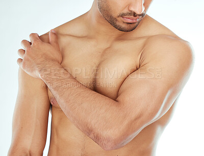 Buy stock photo Body, closeup and man in studio for wellness, cleaning or grooming, routine and treatment against white background. Chest, cosmetics or male model hand touching soft, smooth or glowing skin results