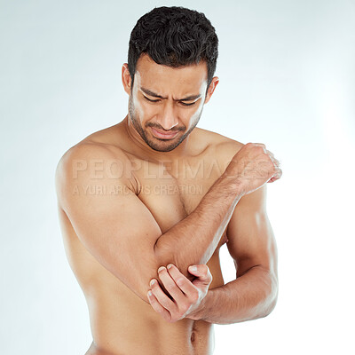 Buy stock photo Arm pain, stress and asian fitness man in studio with muscle tension, arthritis or inflammation on white background. Elbow, injury and Japanese male model with fibromyalgia, osteoporosis or emergency