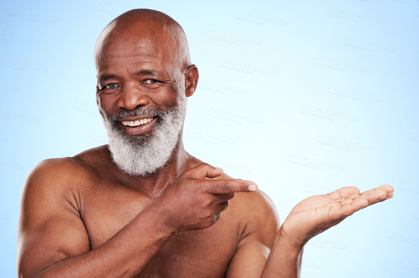 Buy stock photo Black man, portrait and pointing in studio with mockup space for advertising, deal or promotion. Mature person, face and show on blue background with information for marketing, choice or presentation