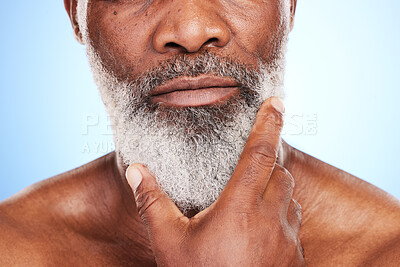 Buy stock photo Cropped shot of an unrecognizable mature man posing in studio against a blue background
