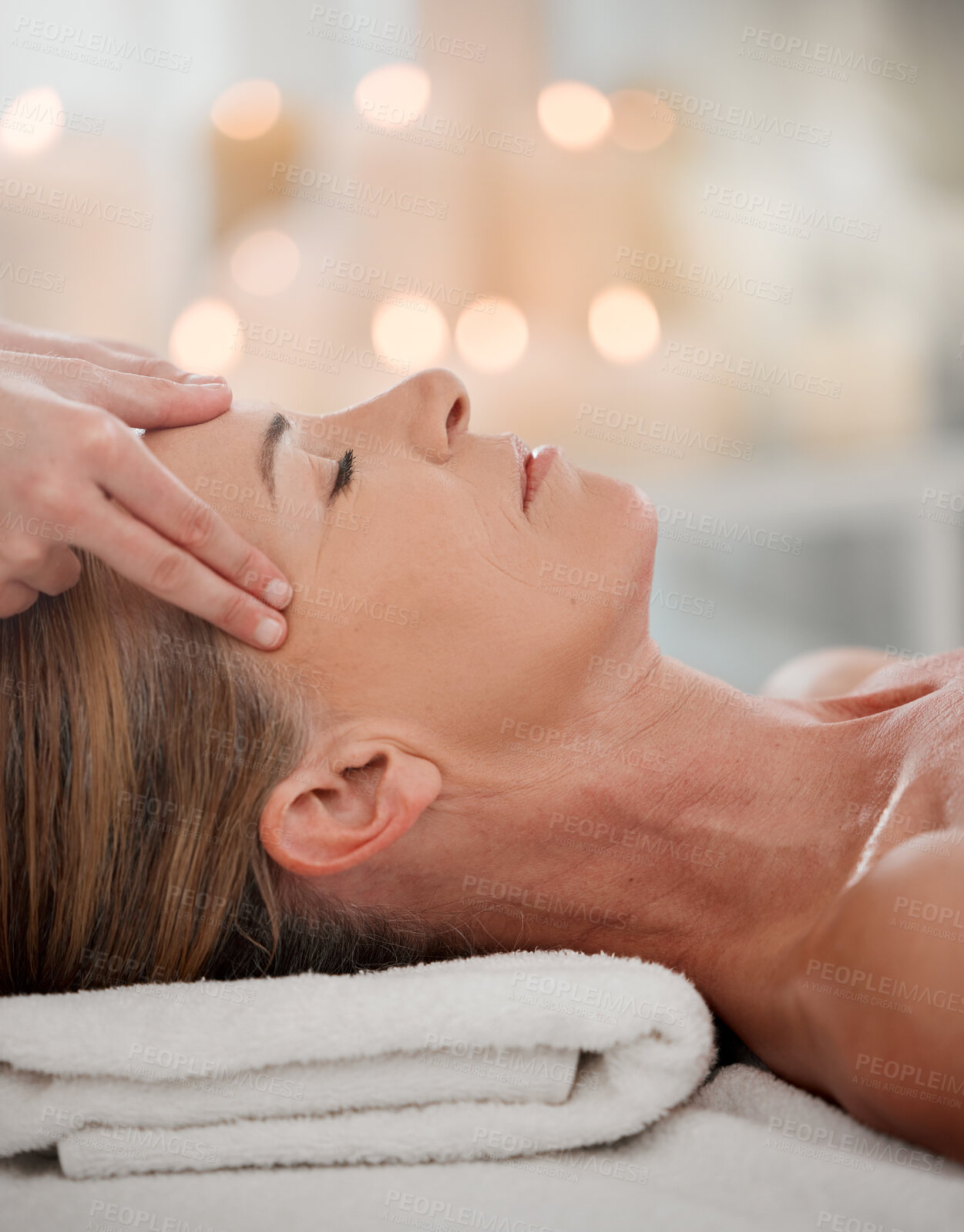 Buy stock photo Resort, head massage and hands of person for relax, luxury treatment or stress relief on bed. Zen, temple and masseuse with mature client for wellness therapy, natural healing or peaceful at spa