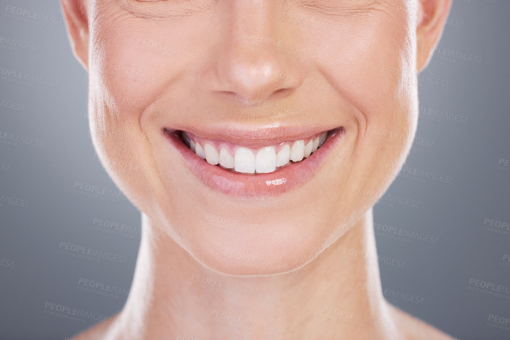 Buy stock photo Woman, smile and teeth whitening results in studio, cosmetics and mouth on gray background. Female person, dental health and satisfaction for oral hygiene, confidence and orthodontics healthcare