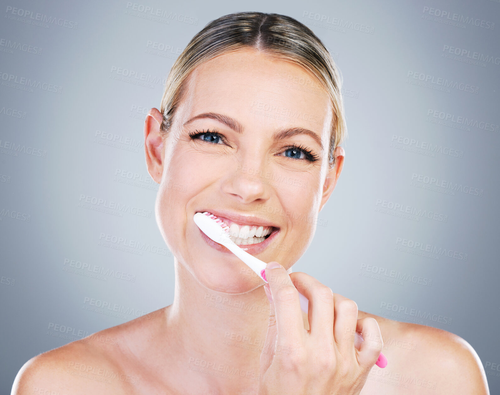 Buy stock photo Happy woman, portrait and toothbrush for brushing in studio, cosmetics and hygiene on gray background. Female person, dental health and teeth for oral care, confidence and orthodontics healthcare