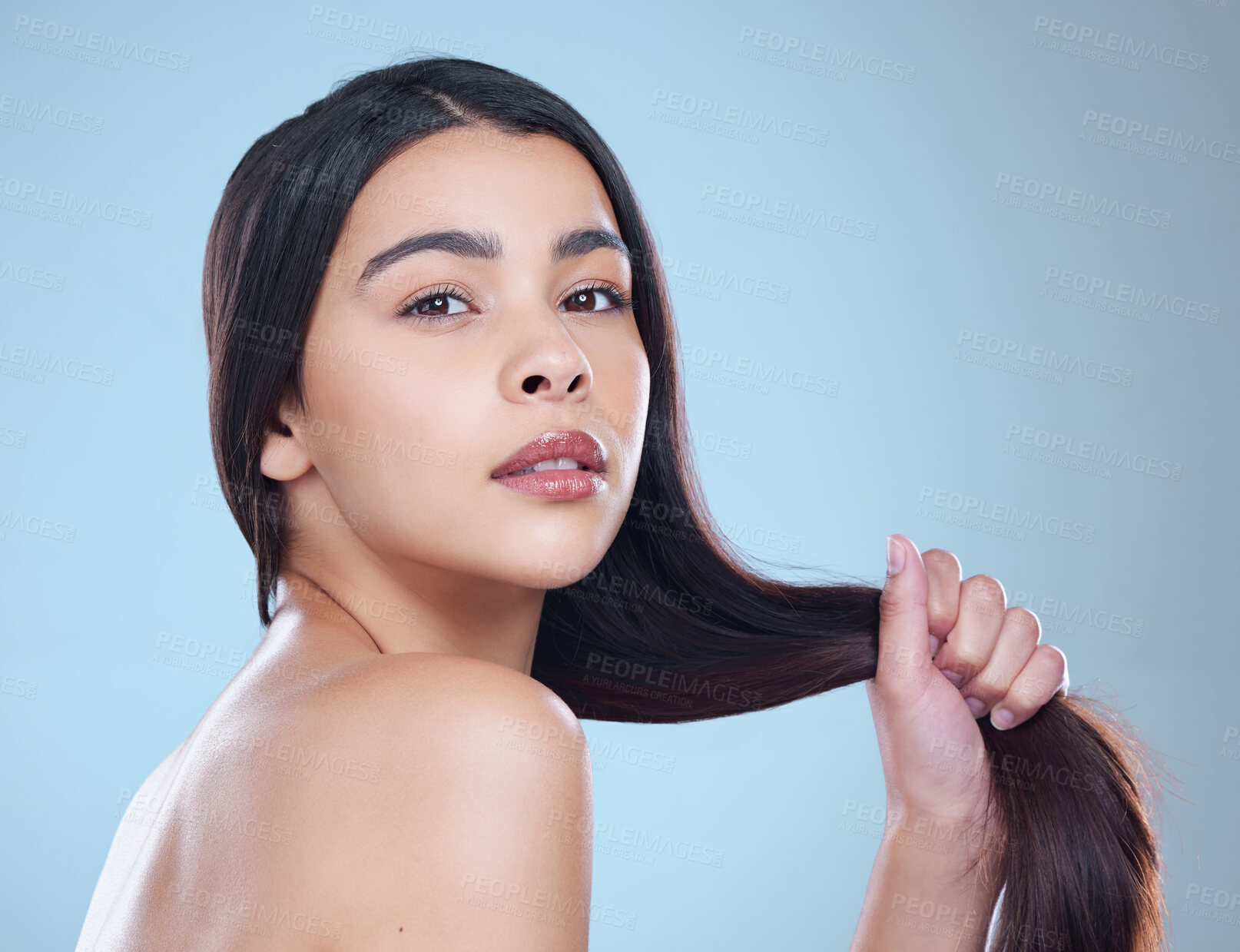 Buy stock photo Hair care, woman and portrait with dermatology, beauty or texture on blue studio background. Person, face or model with glow, volume or grooming routine with aesthetic, growth or shine with wellness