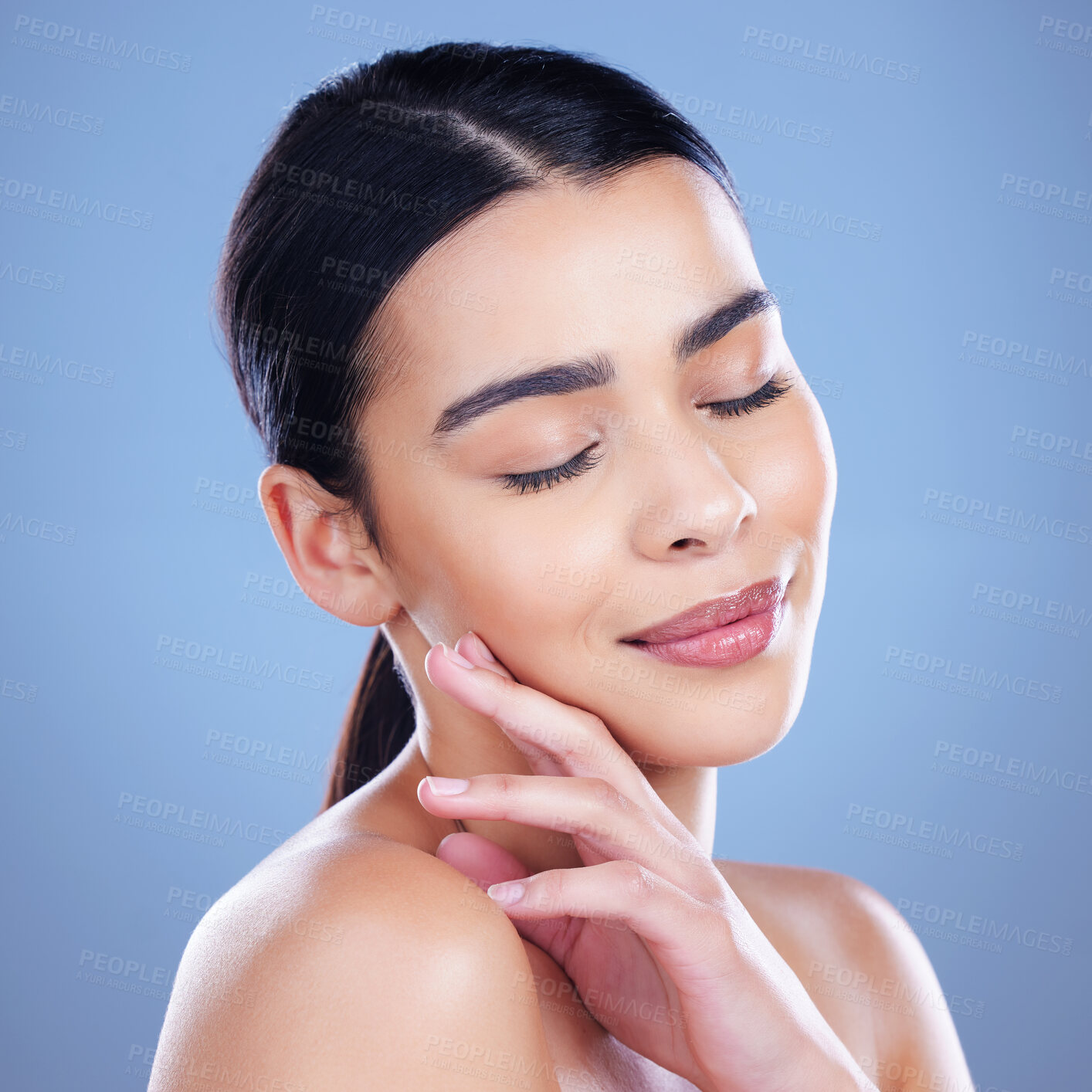 Buy stock photo Skincare, beauty and face of woman on blue background for cosmetics, wellness and skincare. Dermatology, health and person touch for satisfaction with natural skin, salon and facial care in studio