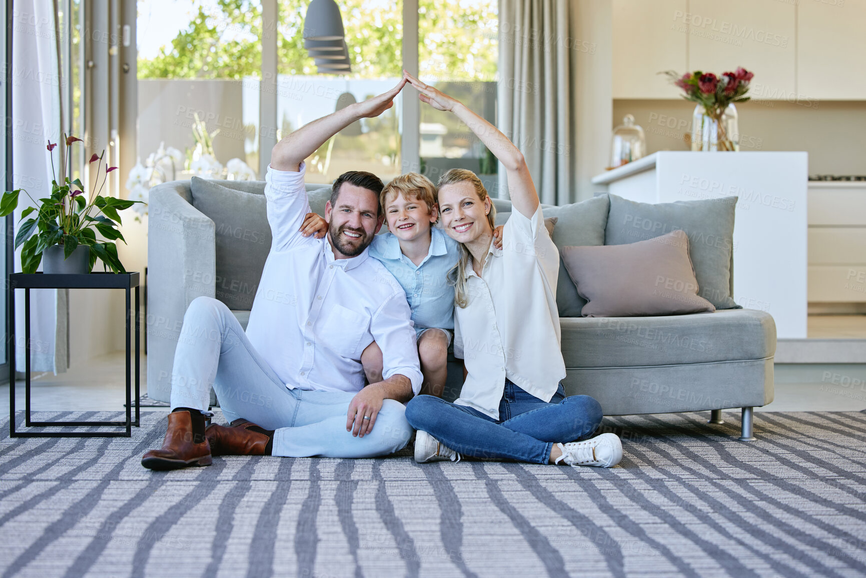 Buy stock photo Hands, security or insurance with portrait of family on floor of living room in home together. Cover, safety or smile with arms of mother, father and children in apartment for property investment