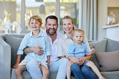 Buy stock photo Cropped portrait of an affectionate mature couple and their kids sitting on the sofa at home