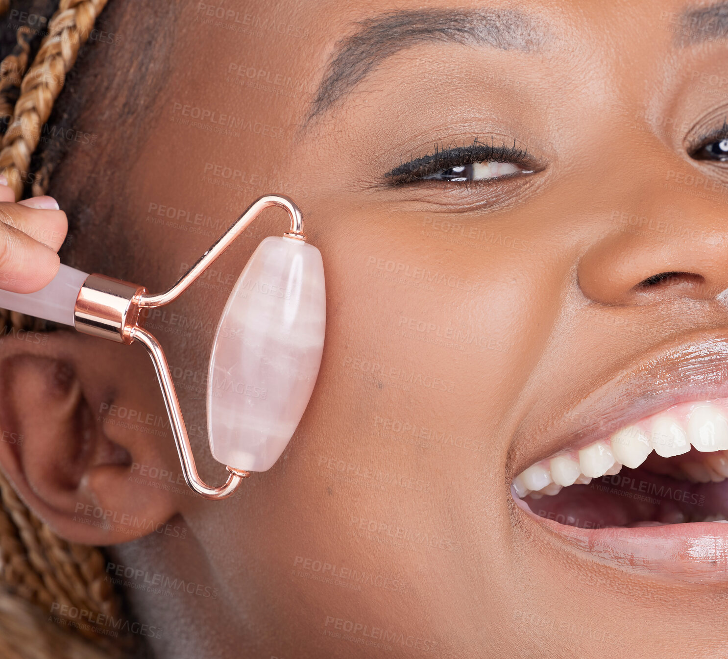 Buy stock photo Woman, portrait and rose quartz roller in studio, closeup and cosmetics for change by white background. African person, model or girl with stone tools, circulation and happy with results for skincare