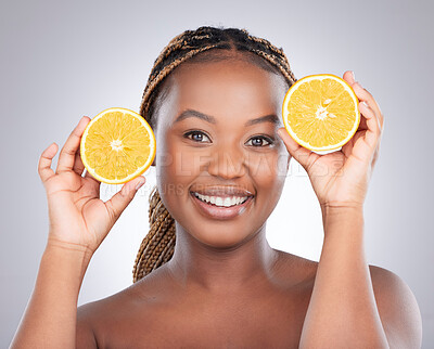 Buy stock photo Beauty, orange and portrait of black woman in studio for natural, cosmetics and vitamin c. Nutrition, diet and detox with face of female model on grey background for citrus fruit and health product