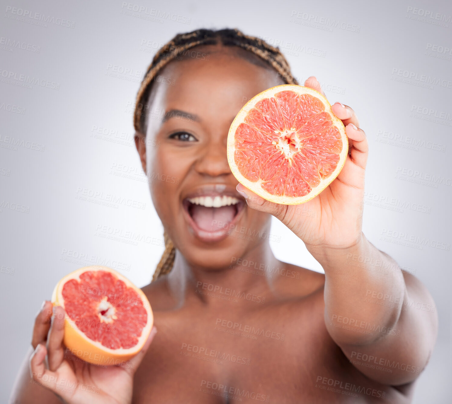 Buy stock photo Beauty, grapefruit and skincare with black woman in studio for natural, cosmetics and vitamin c. Nutrition, diet and detox with female model on grey background for citrus fruit and health product