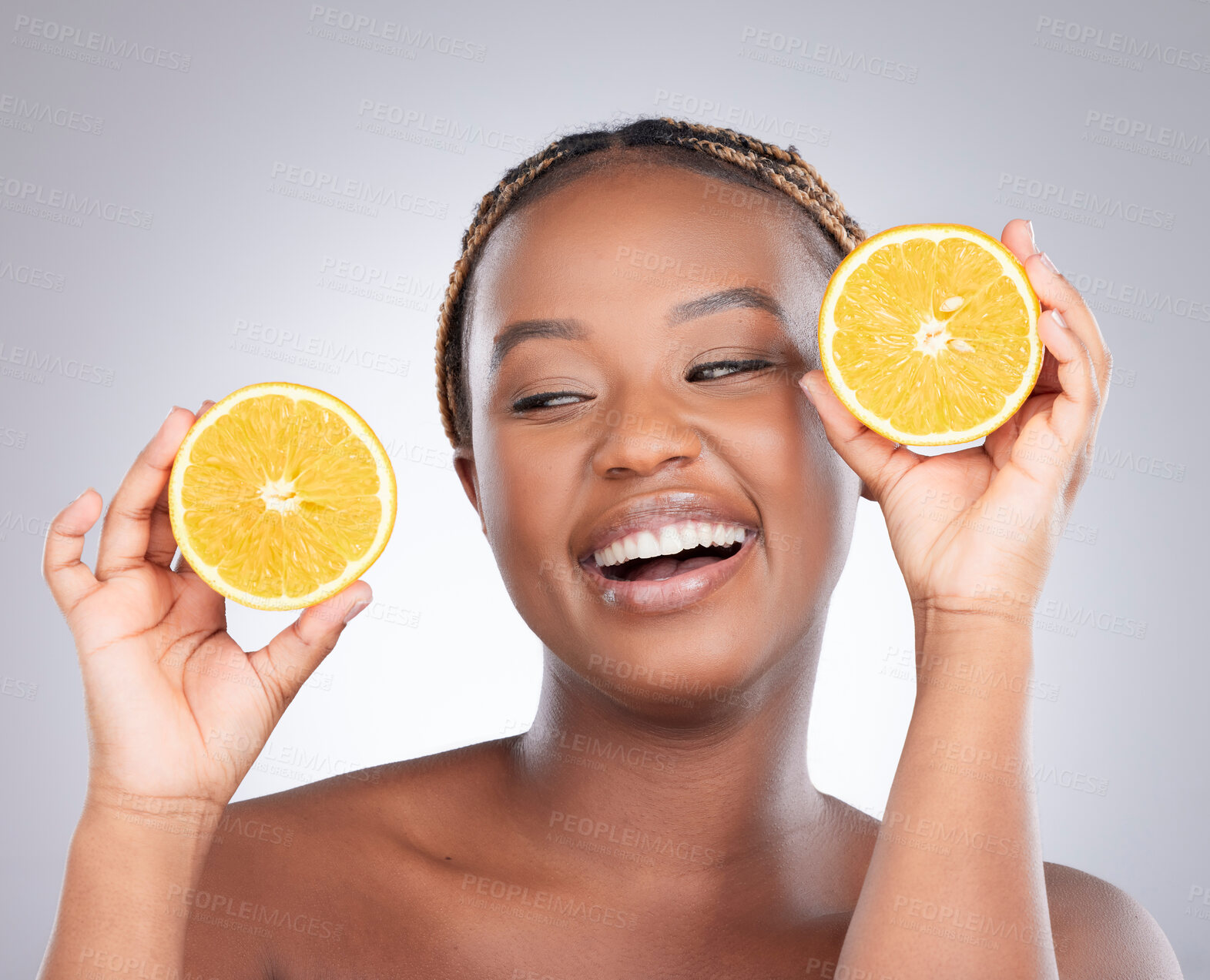 Buy stock photo Beauty, orange and skincare with black woman in studio for natural, cosmetics and vitamin c. Nutrition, diet and detox with face of female model on grey background for citrus fruit and health product