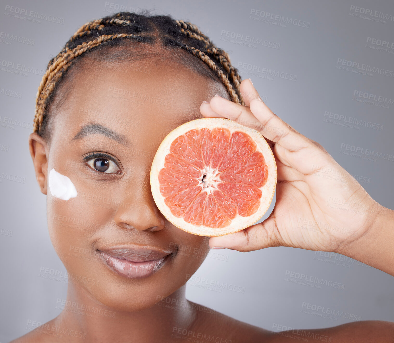 Buy stock photo Face cream, beauty and portrait of black woman with grapefruit for skincare, wellness and facial. Dermatology, fruit and person with moisturizer for vitamins, health or nutrition on studio background