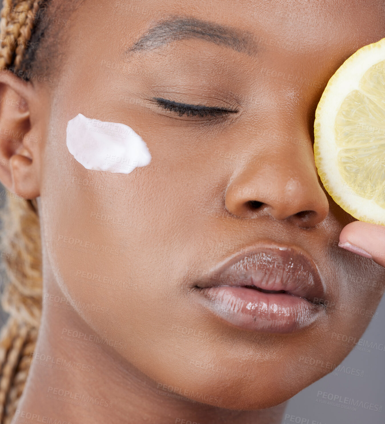 Buy stock photo Face cream, beauty and black woman with lemon in studio for skincare, wellness and facial care. Dermatology, fruit and person with moisturizer for vitamin C, health and nutrition on gray background