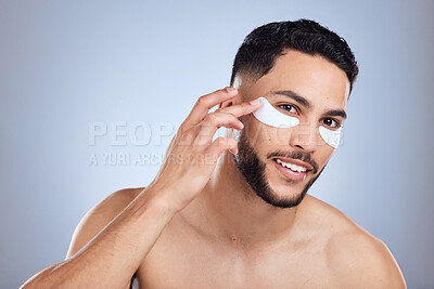 Buy stock photo Skincare, portrait and man with eye patch for beauty and results for healthy glow in studio. Male person, eyes and pad for dark circles with wrinkles prevention and spa aesthetic by gray background