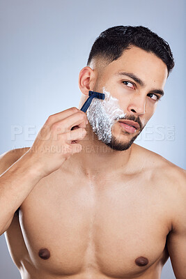 Buy stock photo Man, razor and shaving foam in studio with thinking for hygiene ideas, body and skincare. Male person, thoughts and cream on face with blade for beard maintenance and hair removal by grey background