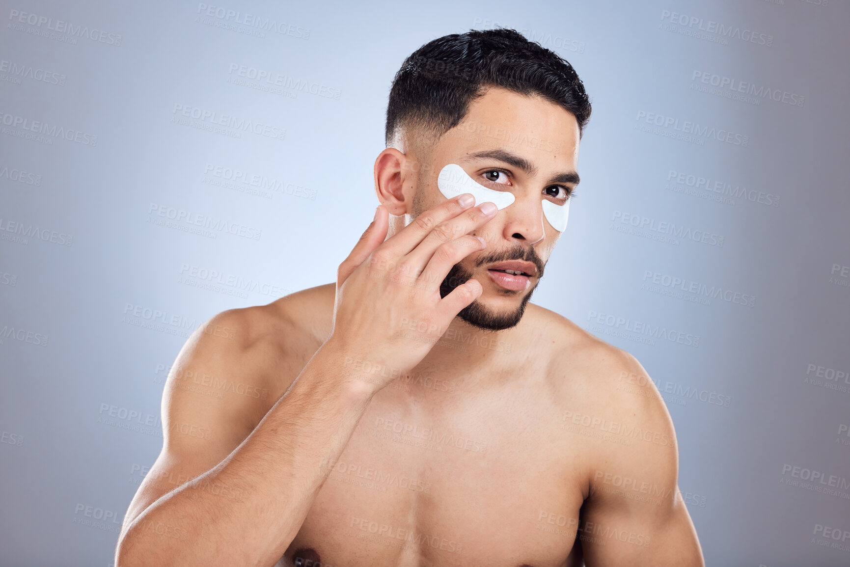Buy stock photo Beauty, man and eye patch in studio for skincare with skin glow results and hyaluronic acid hydration. Male person, eyes and mask for dark circles and wrinkles with spa aesthetic by gray background
