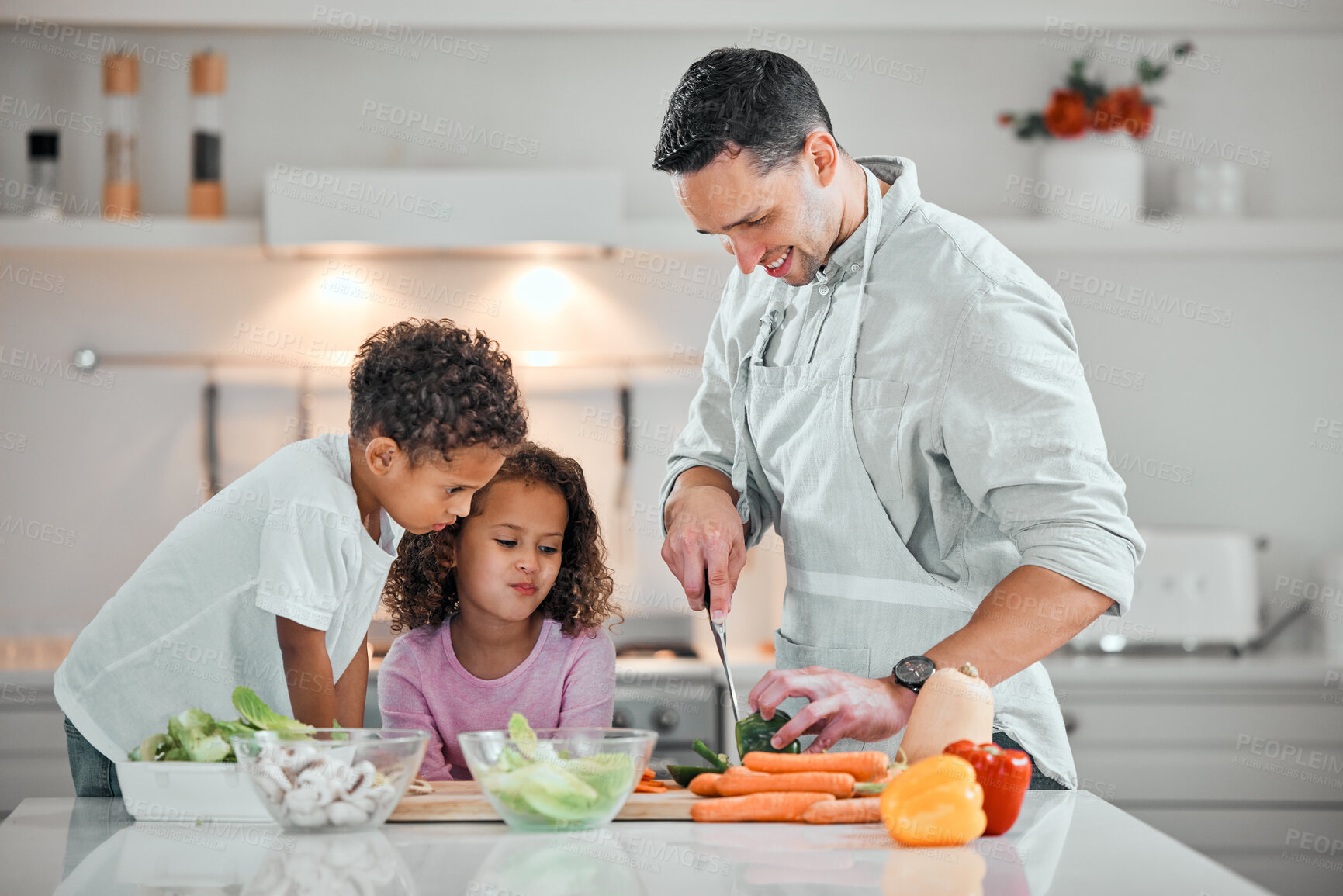 Buy stock photo Cooking, help and meal prep with family in kitchen for health, nutrition and food. Diet, support and dinner with man and children cutting vegetables at home for wellness, organic salad and learning
