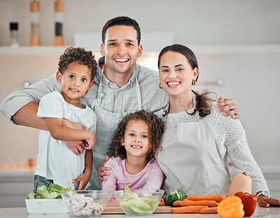 Buy stock photo Cooking, smile and portrait of family in kitchen for health, nutrition and food. Diet, vegetables and dinner with parents and children with meal prep at home for wellness, organic salad and learning