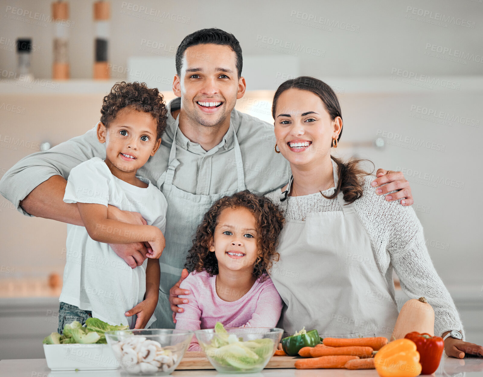 Buy stock photo Cooking, smile and portrait of family in kitchen for health, nutrition and food. Diet, vegetables and dinner with parents and children with meal prep at home for wellness, organic salad and learning