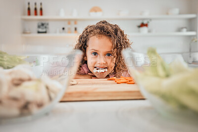 Buy stock photo Shot of a little girl eating healthy at home