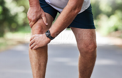 Buy stock photo Running, knee pain and old man with hand on leg in park in for outdoor fitness and workout exercise. Health, wellness and muscle strain, senior runner with injury, hands on ache in support or relief.