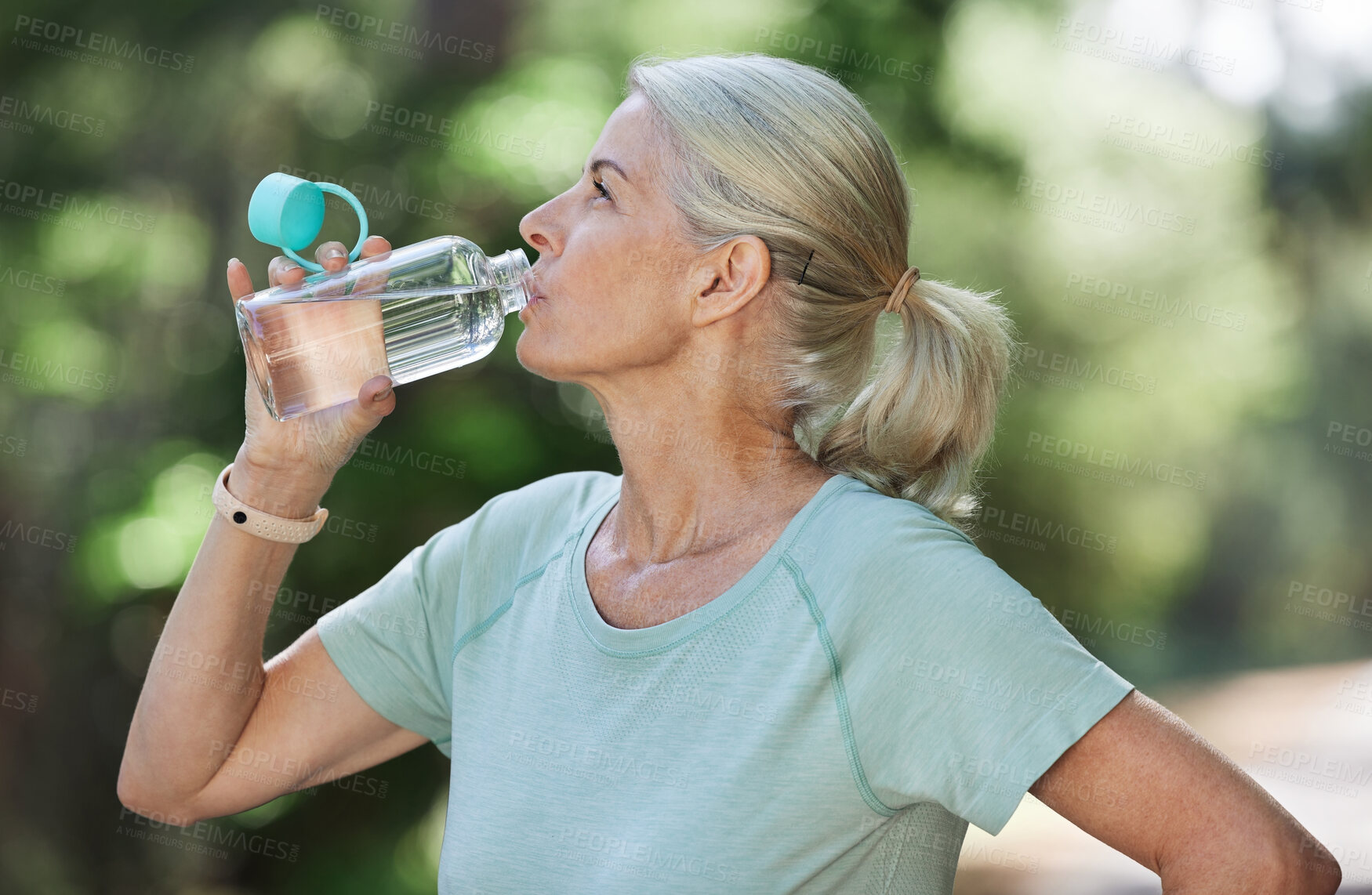 Buy stock photo Exercise, workout and senior woman drinking water, park and training for fitness, wellness and healthy lifestyle. Mature female, nature and lady with aqua, retirement practice for energy or cardio