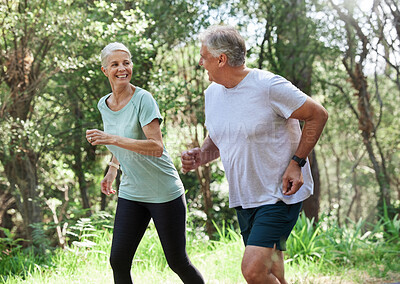 Buy stock photo Senior couple, exercise and happy outdoor for run, workout and training for fitness. Old man and woman in forest for cardio health, motivation and wellness in retirement while running in nature