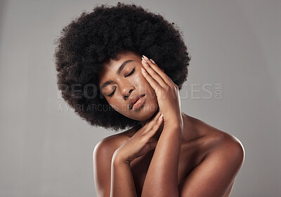 Buy stock photo African, woman and skincare with feeling and facial treatment or wellness in studio background. Beauty, dermatology and hands on face with glowing, clear and healthy skin for self care with afro.