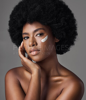 Buy stock photo Black woman in portrait, cream and beauty with skincare and cosmetics product on studio background. Natural, afro hairstyle and African female model, dermatology with lotion and facial moisturizer