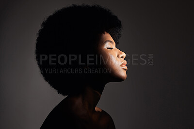 Buy stock photo Face shadow, light and black woman with skincare, natural beauty glow and peace after cosmetics treatment. Aesthetic makeup profile, afro and African studio person with self care on grey background