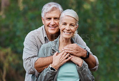 Buy stock photo Love, portrait and elderly couple hug in a forest for hiking, relax and walking in nature on blurred background. Face, embrace and happy senior man with woman on retirement vacation in the woods