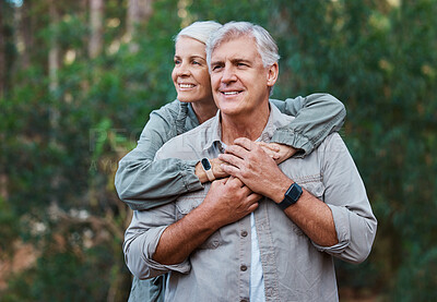 Buy stock photo Senior couple, hiking and hug outdoor in nature for exercise, fitness and trekking for health and wellness. Old man and woman thinking, care and smile on forest hike for cardio workout in retirement