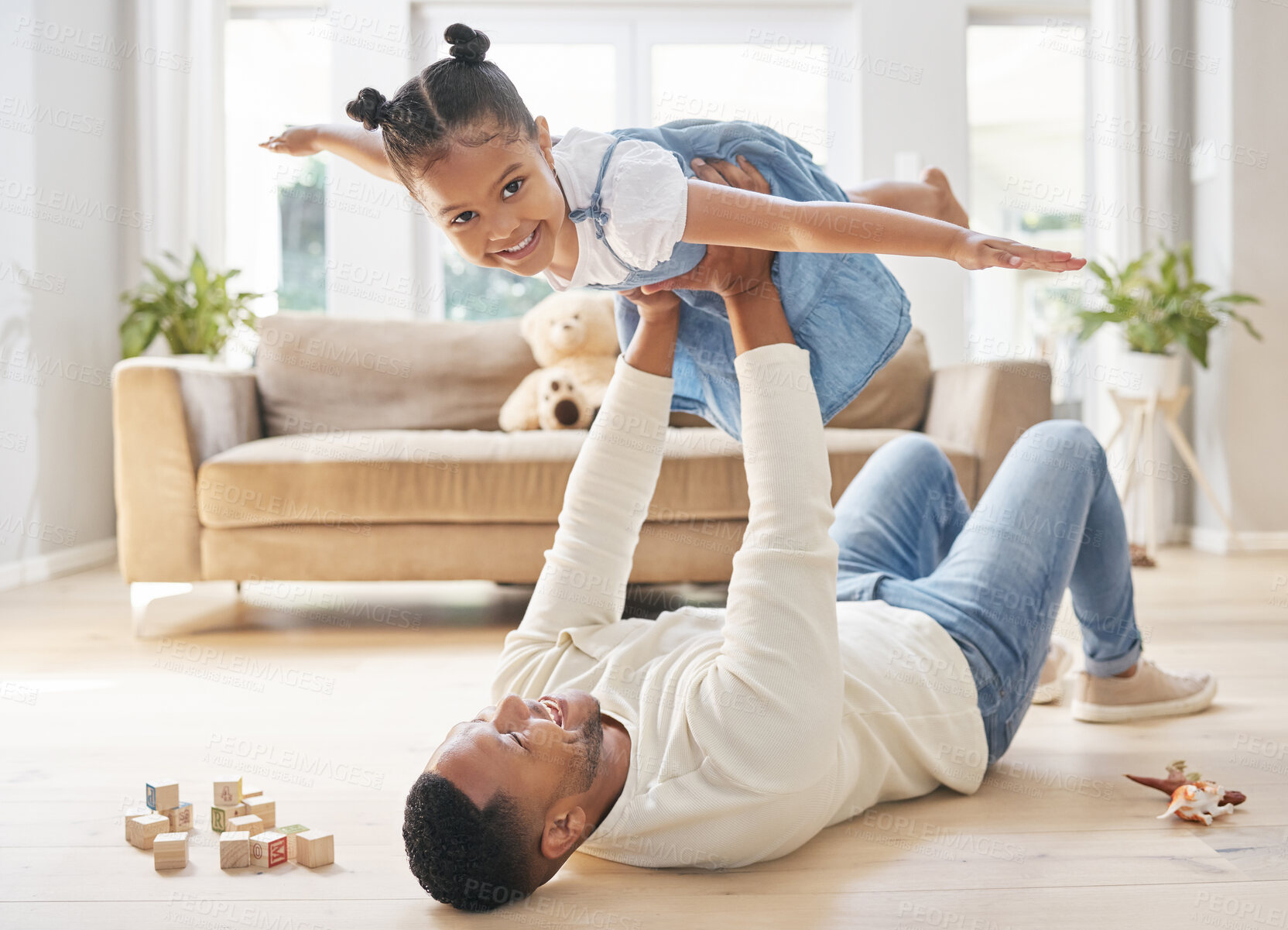 Buy stock photo Father, girl and portrait with airplane game for childhood fun, weekend bonding and playful with love or care. Dad, child and holding or lifting daughter in air or house for flying, support and floor