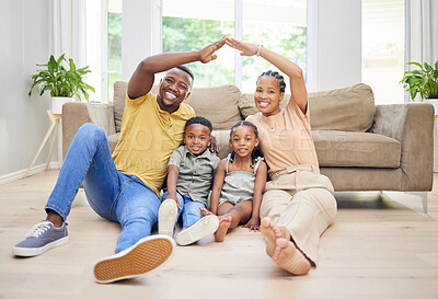 Buy stock photo Portrait, black family and roof hands in home for security, care or protection. Insurance, African man and woman, children and kids with love, safety or support to smile together on living room floor