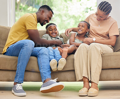 Buy stock photo Black family, children and tickling or playing on home sofa with happiness, love and care. African kids, man and woman or parents together on a couch for fun, quality time and laughing while bonding