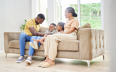 Buy stock photo Children, mother and father tickling or playing on home sofa with happiness, love and care. Black kids, man and woman or parents together on a couch for fun, family time and laughing while bonding