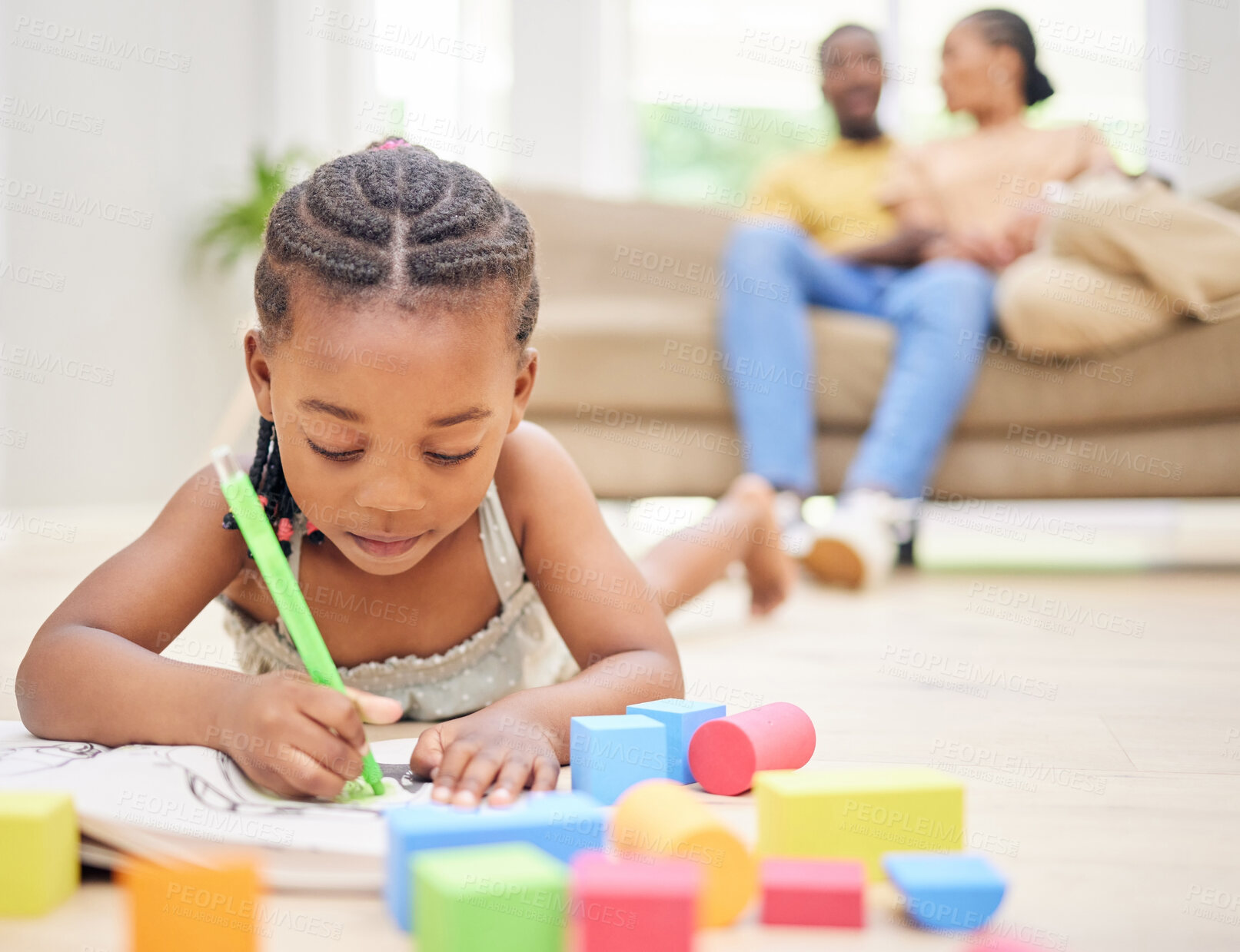 Buy stock photo Girl child, living room or drawing with book for youth creativity, paper for art project or school. Black people, learning and parents together on couch with development in house, relax with kid