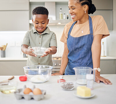 Buy stock photo Mother, child or family baking together at kitchen counter for help and love. Black woman or mom and happy kid or son in a house cooking food, dessert or pancakes for learning and development