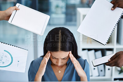 Buy stock photo Shot of a young call centre agent looking stressed out while working in a demanding office environment