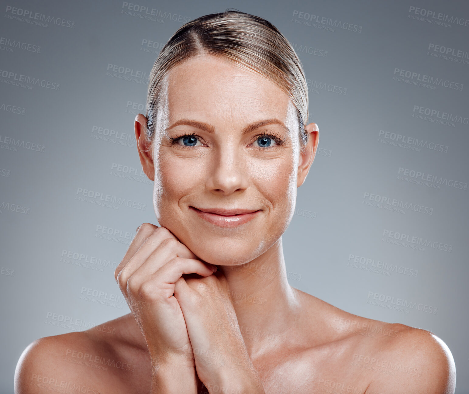 Buy stock photo Beauty, portrait and smile of mature woman in studio on gray background for facial cosmetics. Half face, skincare and wellness with happy person at salon or spa for antiaging dermatology treatment