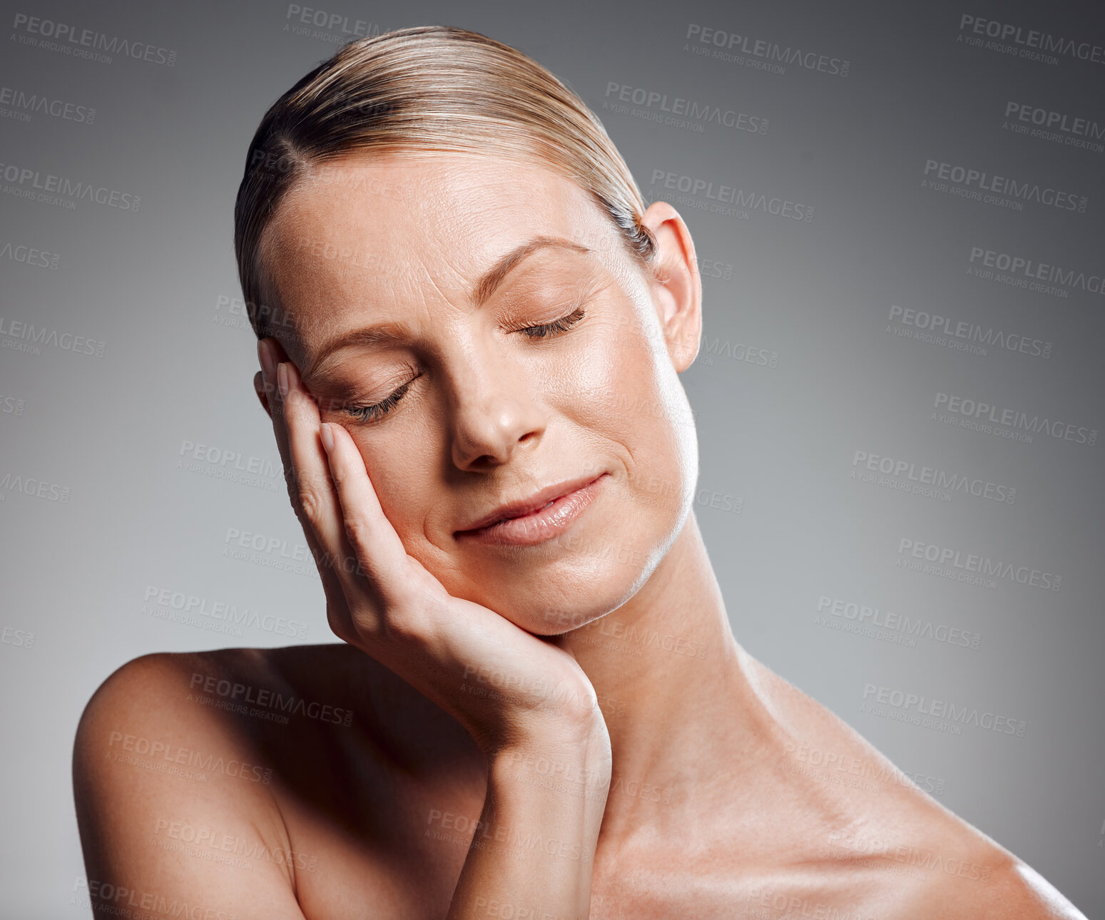 Buy stock photo Beauty, hand and sleep with mature woman in studio on gray background for facial cosmetics. Face, skincare and wellness with person at salon or spa to relax for antiaging dermatology treatment