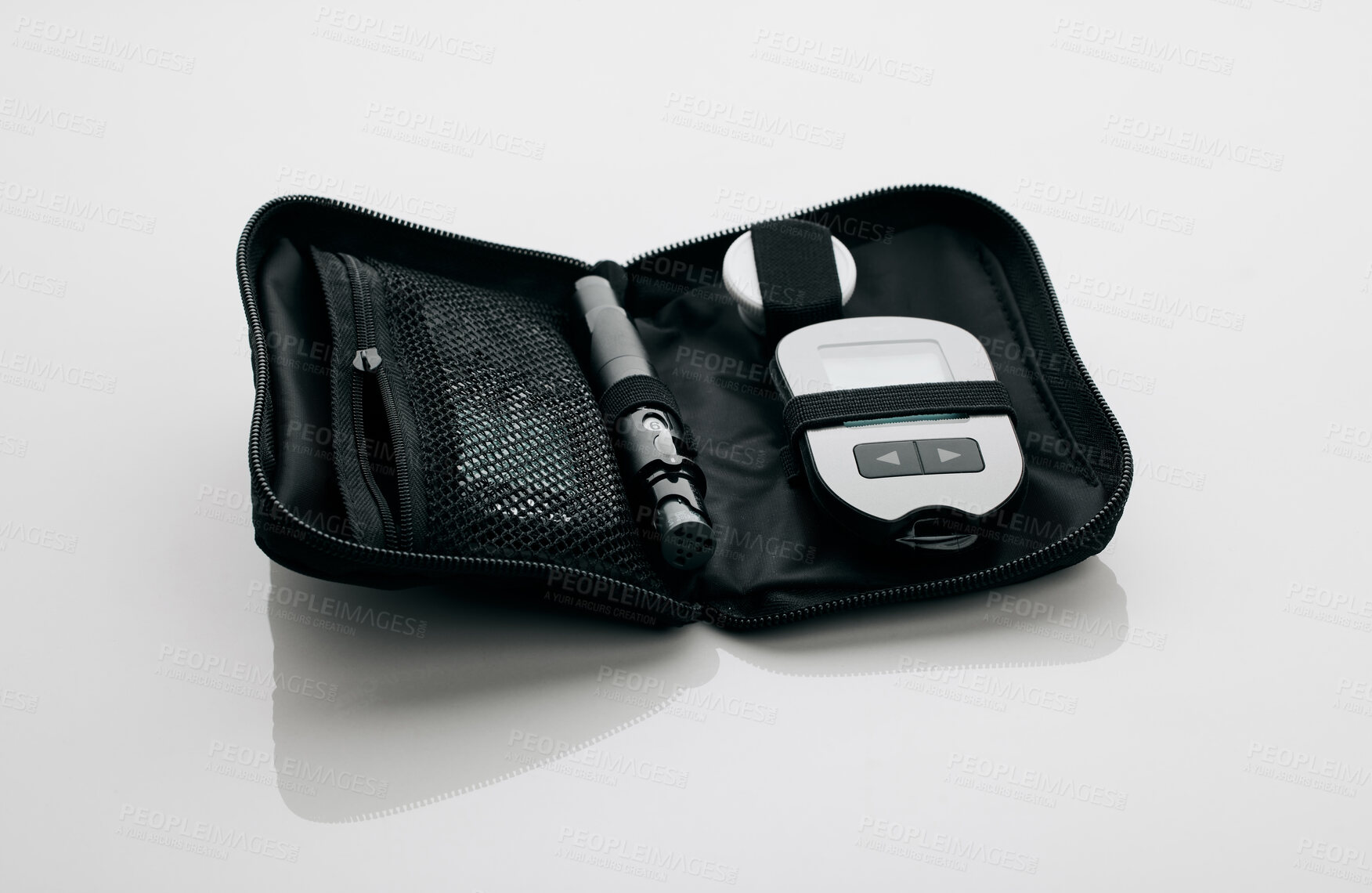 Buy stock photo Glucose meter, medical and healthcare in studio, bag and portable device for sugar level and blood. Treatment, medicine and technology for diabetes, monitor and equipment to track for insulin