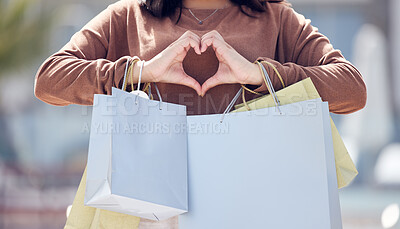 Buy stock photo Heart hands, person and shopping bags from fashion clothing discount, deal and sale. City, woman and emoji hand sign with love for retail purchase, style payment and boutique in town at mall 