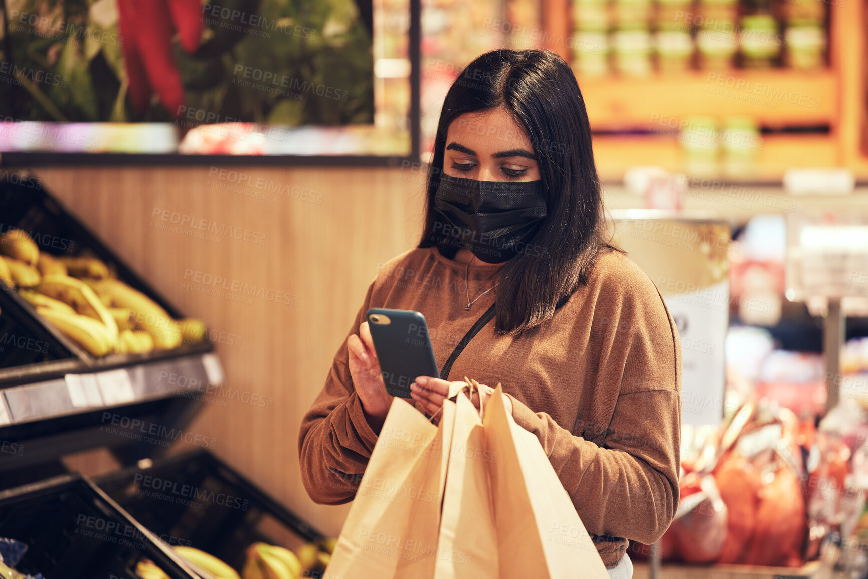 Buy stock photo Grocery store, face mask and woman with phone for shopping list, inventory and healthy food. Eco friendly, organic vegetables and girl at sustainable supermarket with paper bag, ppe or social safety