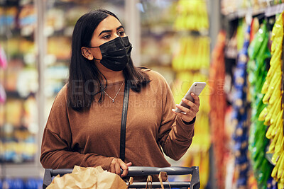 Buy stock photo Woman, phone and grocery checklist in shopping for food, luxury or product with face mask at supermarket. Female person or customer with mobile smartphone app for ingredient or groceries at store